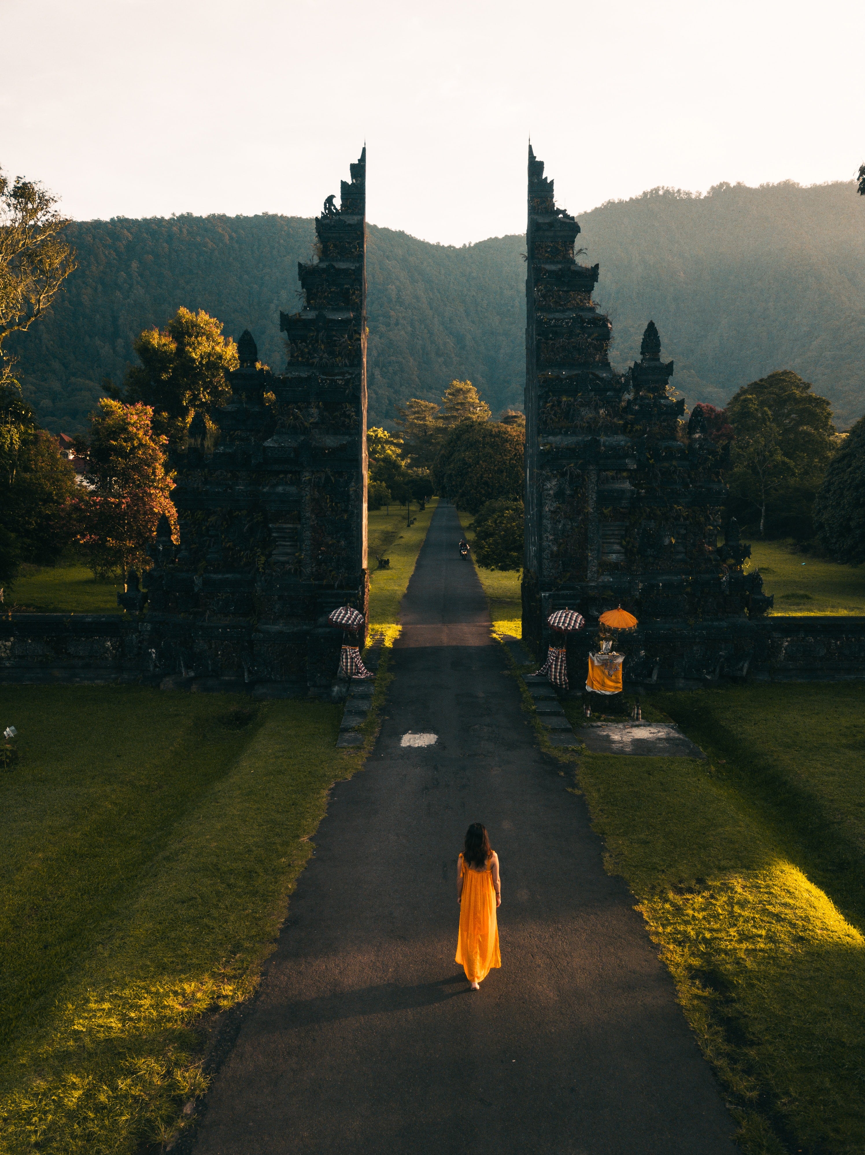 Back View of a Woman Walking Towards the Famous Bali Handara Gate